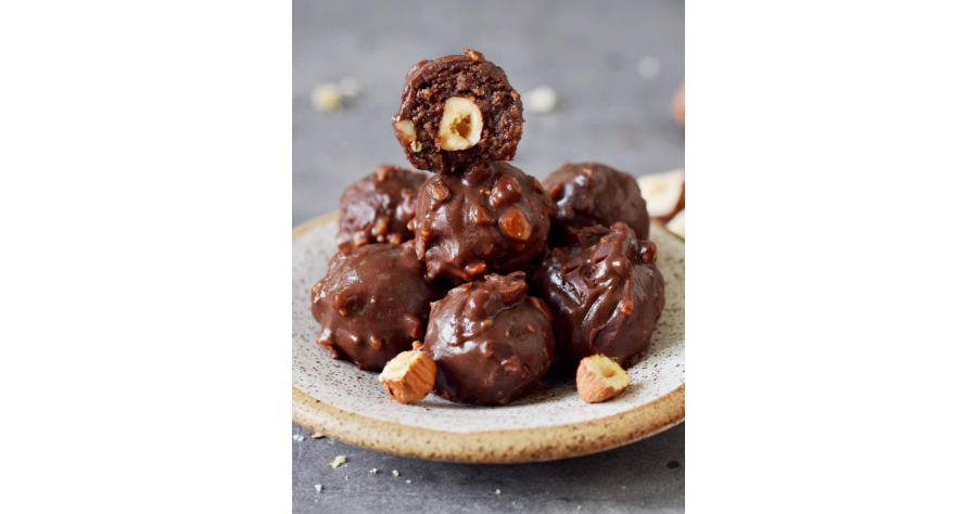 7-homemade-Ferrero-Rocher-truffles-on-a-small-plate-with-one-showing-the-inside