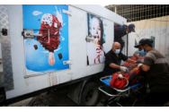 Camioane frigorifice cu imagini cu copii zâmbitori care mănâncă îngheţată sunt acum morgi pentru victimele razboiului